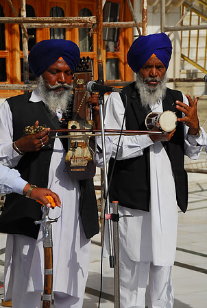 Priests playing traditional instruments at Golden Temple