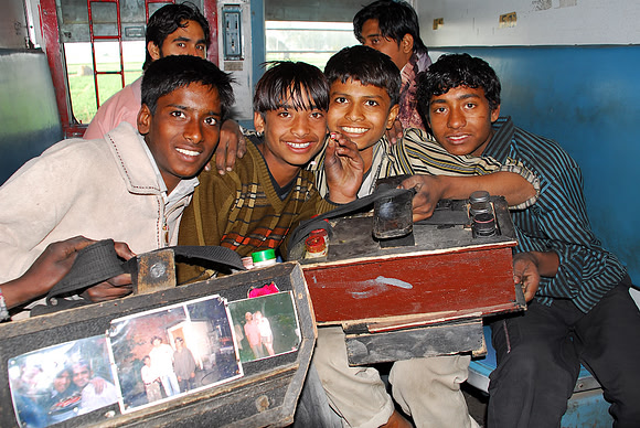 These boys are all friends and watch out for each other as they spend days shining shoes on trains