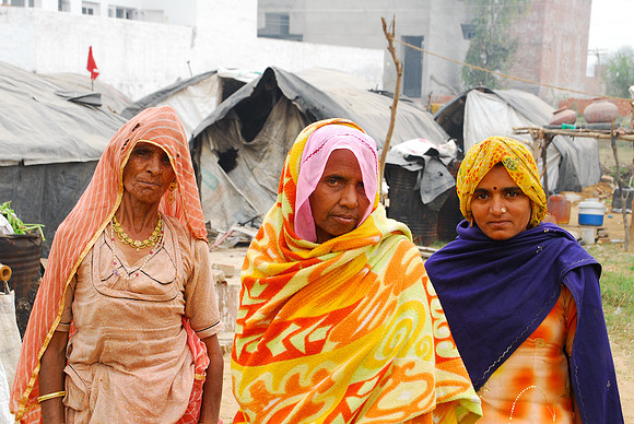 Ladies living in the huts of the "not-so-wealthy"
