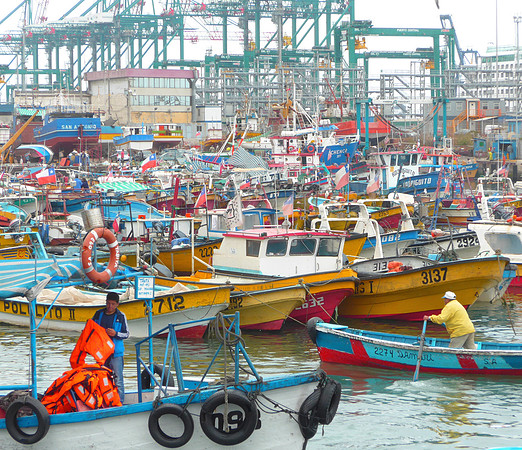 Container cranes and fishing boats