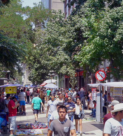 Pedestrian-only street full of shops and vendors