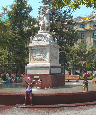 Kids playing in central plaza fountain