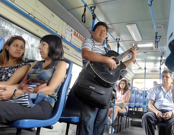 Musician busker on local bus - Lima