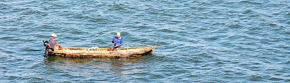 Local fishermen in old boat