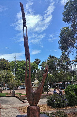Wooden carving in Place des Cocotiers