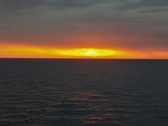 Sun setting in waters of New Caledonai