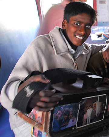 Young boy who shines shoes on trains across Punjab